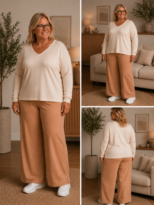 En løs buks med brede ben som har en slids forneden, der er elastik i liv og den går højt op i talje. anvendelig til så mange forskellig overdele. Perfekt til plus size kvinderne. 

Billedet er genereret vha. AI-teknologi for at vise buksen på en person. 
