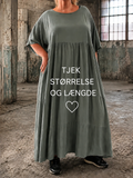 Lolli kjole i ensfarvet – løs og luftig kjole i midi længde med korte ærmer og rund hals. Kjolen har en afslappet pasform med let rynk under brystet, der giver et feminint fald. Fremstillet i let materiale, perfekt til hverdagsbrug og komfort billed er Ai  generet.