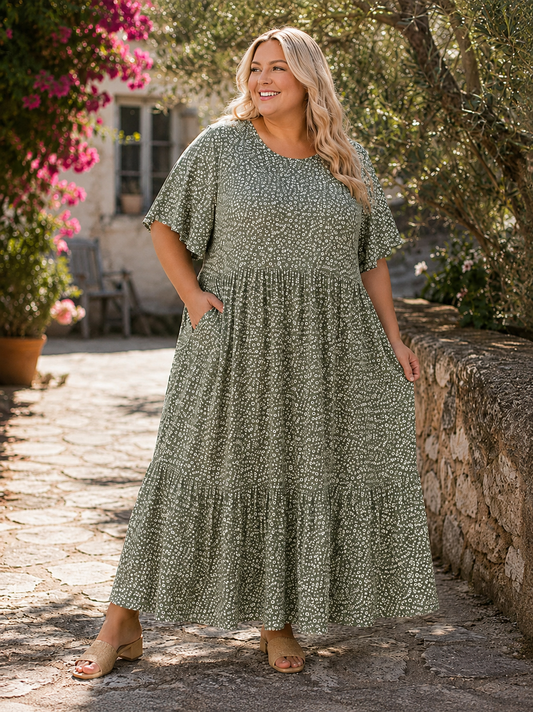 Denne smukke kjole er samme gode facon som vores Lolli kjole. Denne model er bare med blomster-print i stedet. 

Billedet er AI-genereret for at vise kjolen på et menneske.