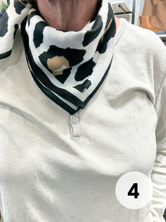 Smart viskose tørklæde som er perfekt til at give dit sæt lidt ekstra pynt.