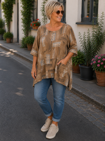 Sille plussize bomuldstunika i let, vævet bomuld med rund hals og lommer. Komfortabel pasform og fås i flere flotte farver. Perfekt til hverdagen.
