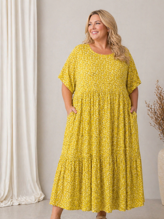 Denne smukke kjole er samme gode facon som vores Lolli kjole. Denne model er bare med blomster-print i stedet. 

Billedet er AI-genereret.